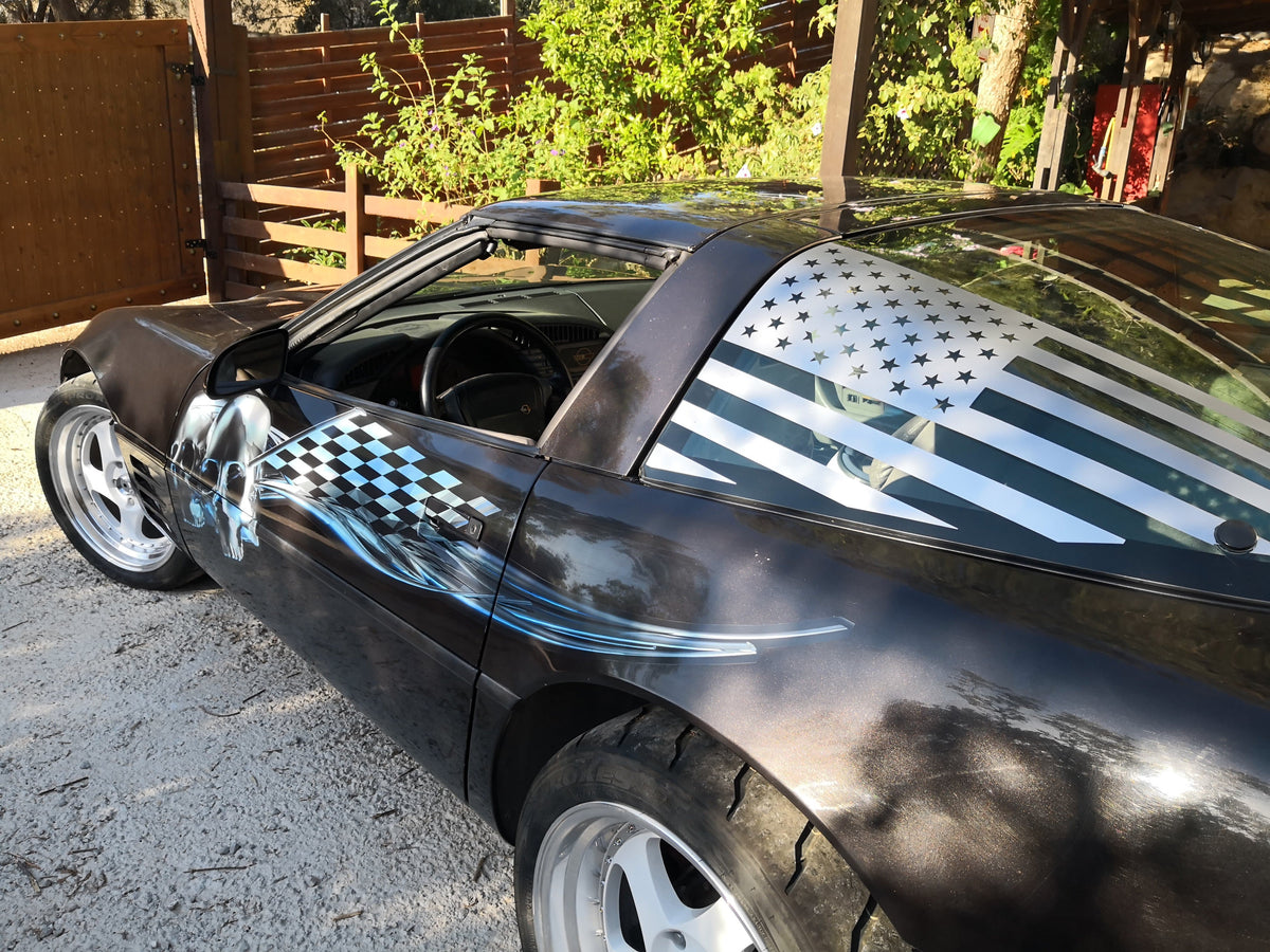chrome skull checkers vinyl graphics on black corvette